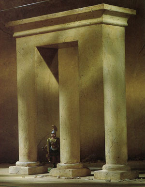 A soldier guards a mysterious ruin! At the bottom are three pillars, when he looks up…  Yikes! Can what he guards be real? This type of illusion is called the Blivet, and is often called an impossible object, where the object appears to have three cylindrical prongs at one end which then mysteriously transform into two rectangular prongs at the other end.