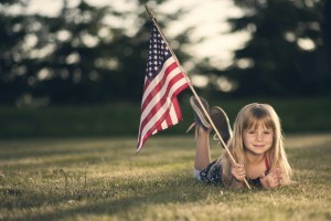 Little girl with American flag.