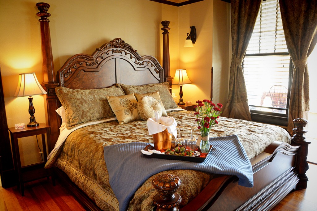 Cogdell Suite majestic king bed with luxury linens at the Iron Horse Inn