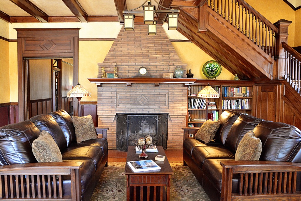 Grand entry room provides seating, fireplace, and access to the second floor of the Iron Horse Inn