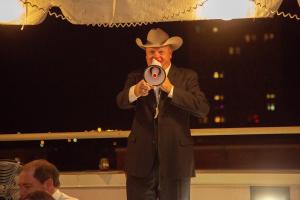 Cade Browning engages with bidders on the rooftop during the live auction