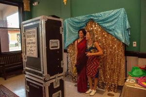 Mishi Mathur and Jody Klotz pose in the photo booth